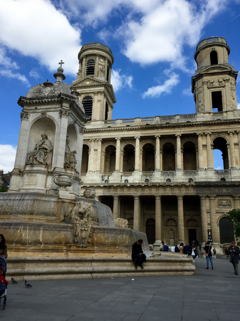 saint-sulpice facade with fountain in front